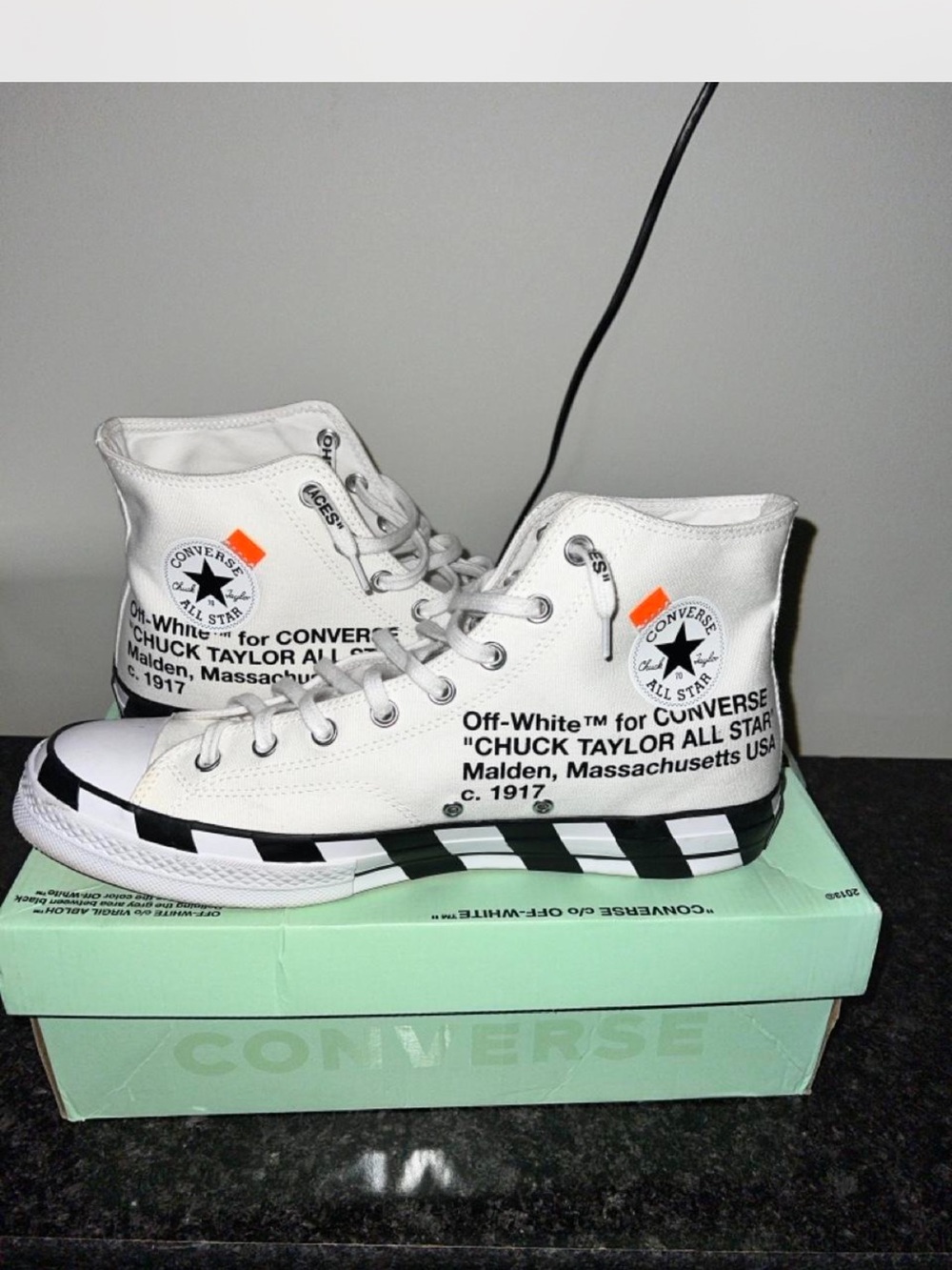 Converse White High-Top Sneakers with Black Checkerboard and Orange Tabs